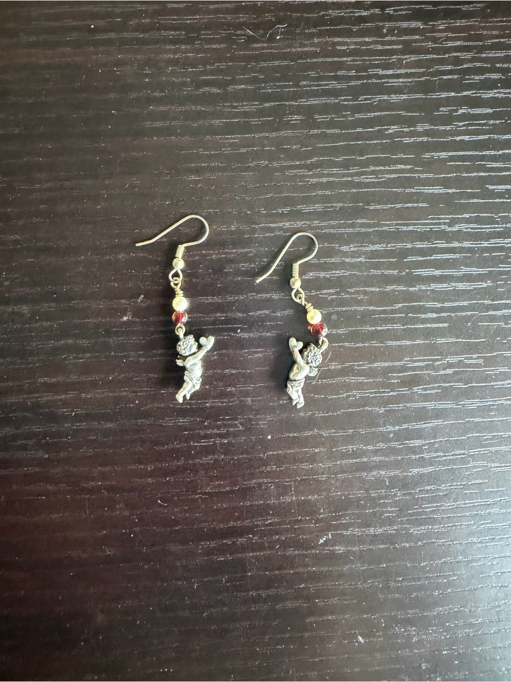Silver-tone cherub dangle earrings